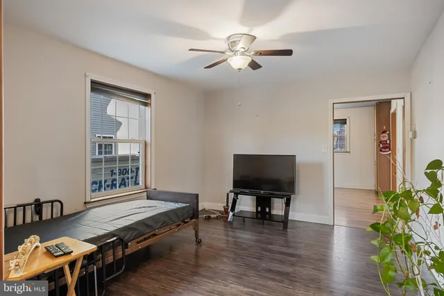 a bedroom with furniture and a window