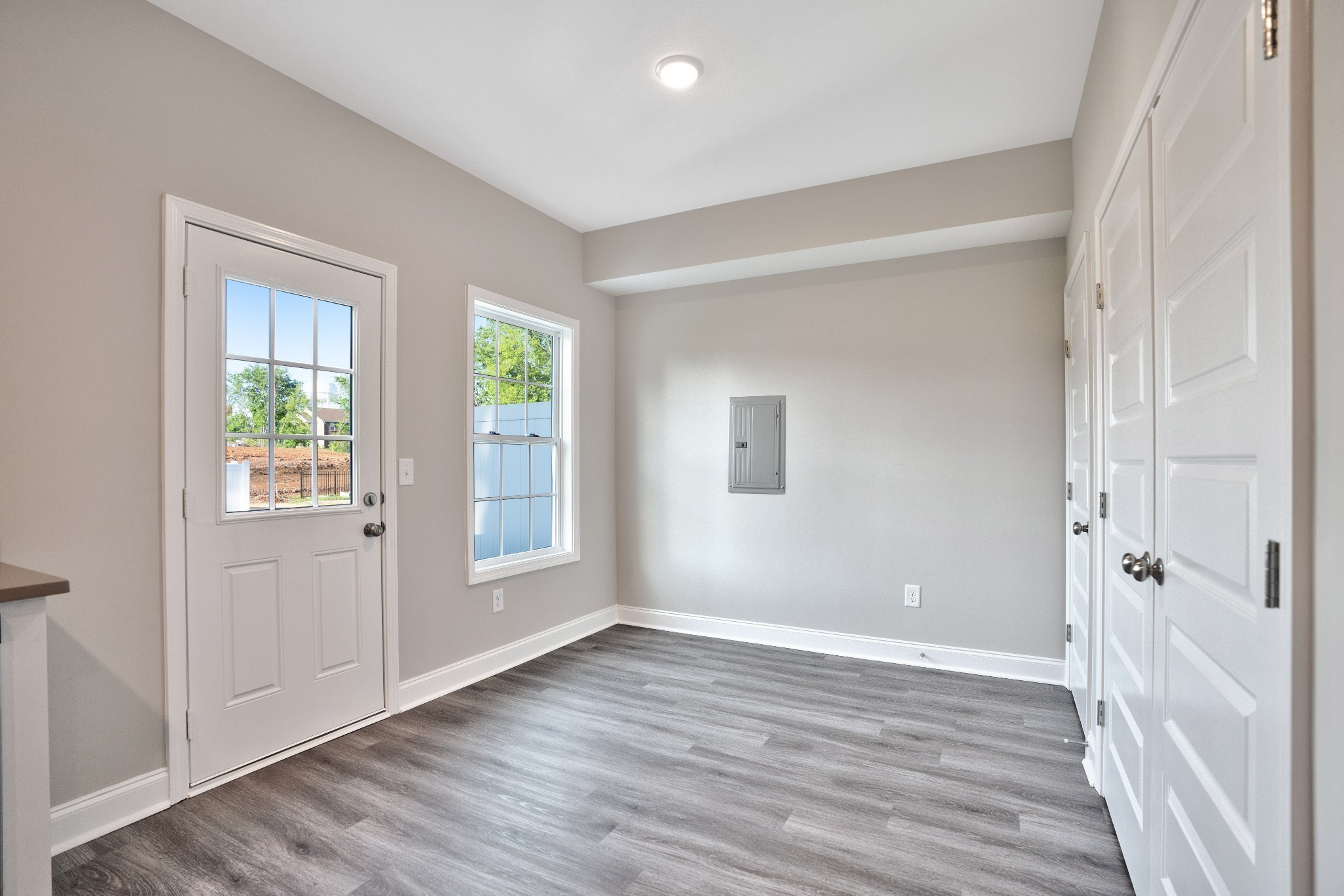 2500 Tiny Town Road, Unit 70 Clarksville, TN 37042 - Photo 14 of 27 an empty room with wooden floor and windows
