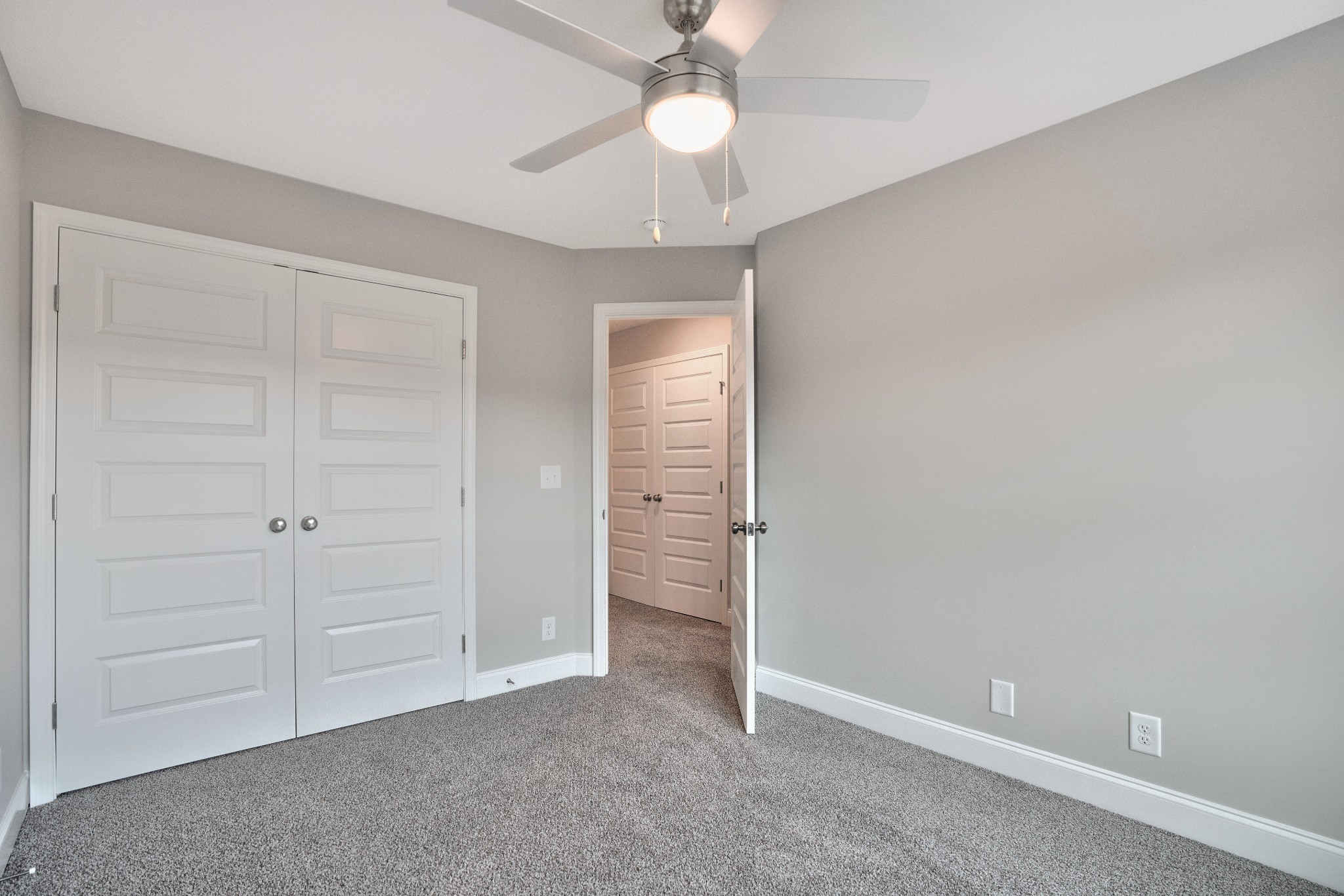 2500 Tiny Town Road, Unit 70 Clarksville, TN 37042 - Photo 24 of 27 an empty room with closet and a chandelier fan