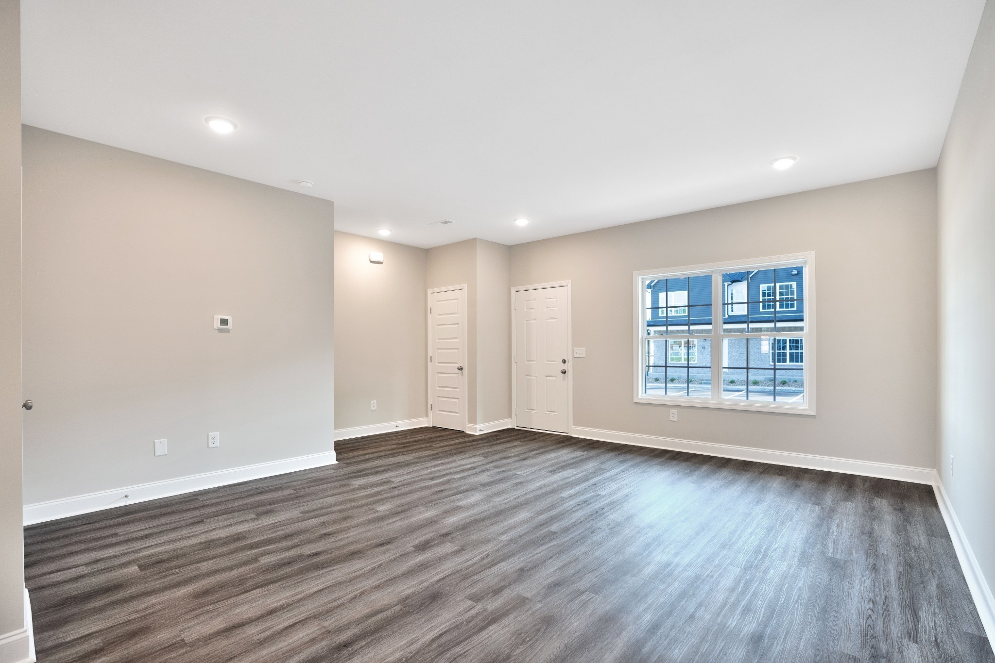 2500 Tiny Town Road, Unit 70 Clarksville, TN 37042 - Photo 7 of 27 a view of an empty room with wooden floor and a window