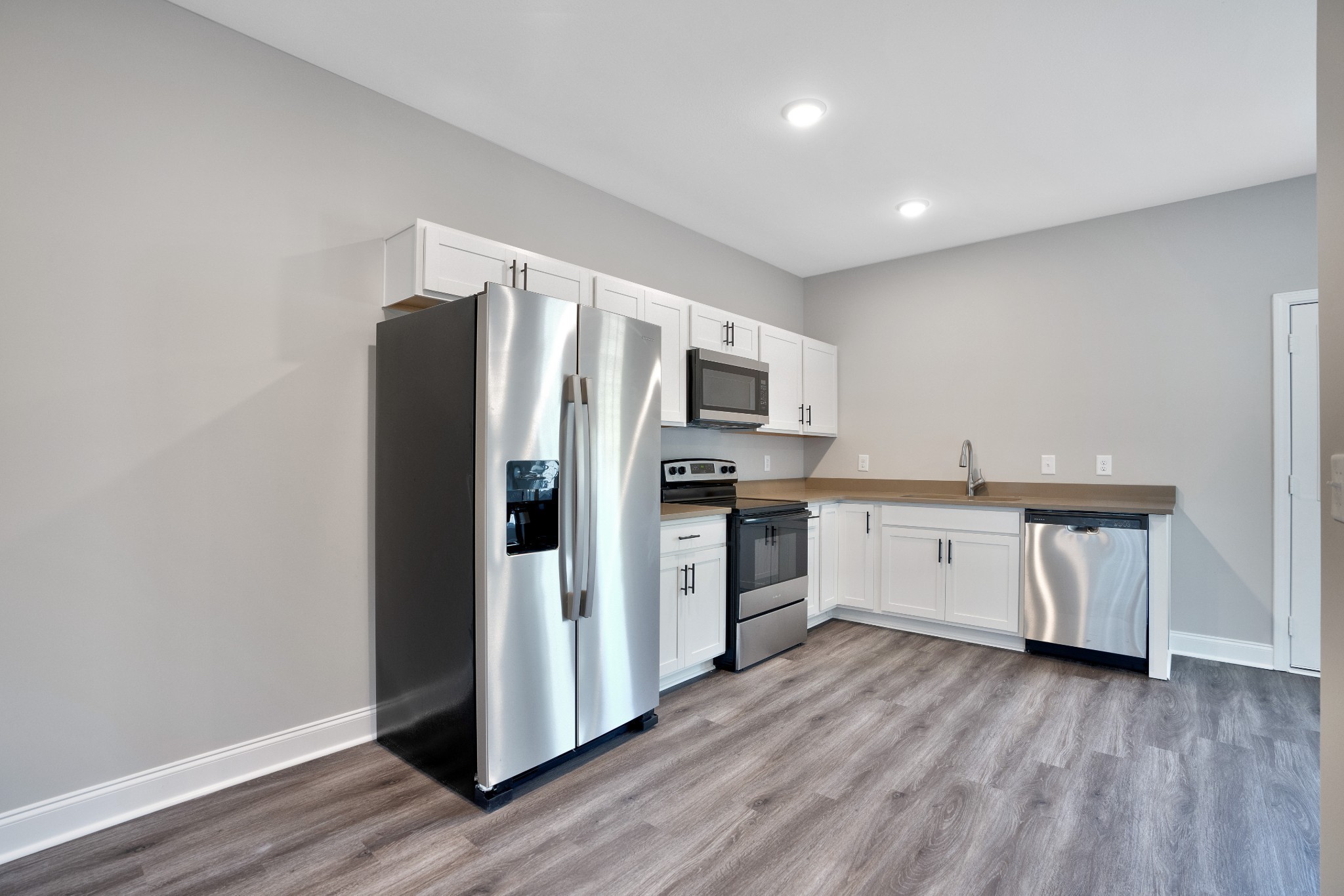 2500 Tiny Town Road, Unit 70 Clarksville, TN 37042 - Photo 8 of 27 a kitchen with a refrigerator cabinets and wooden floor