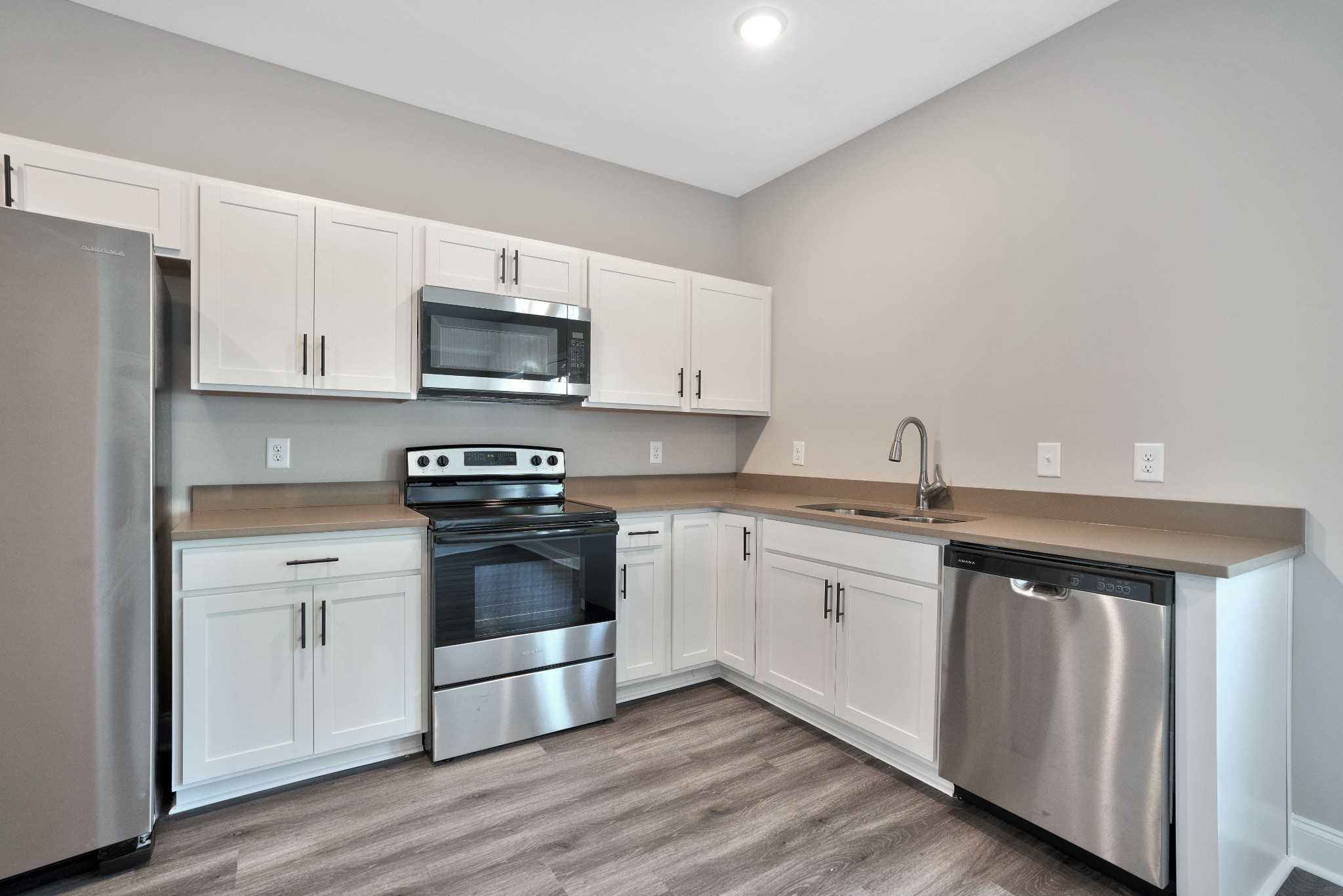 2500 Tiny Town Road, Unit 70 Clarksville, TN 37042 - Photo 9 of 27 a kitchen with stainless steel appliances granite countertop a stove a sink and a microwave