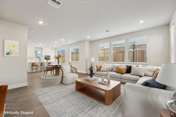 a living room with furniture and a table