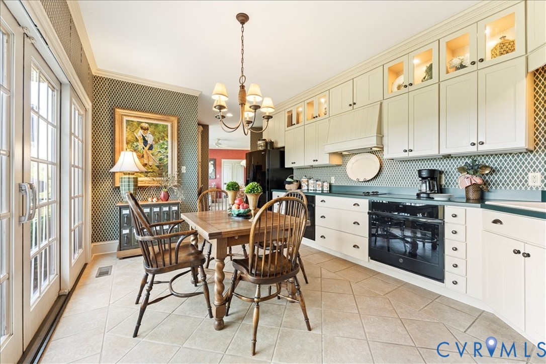 3581 Richards Run Powhatan, VA 23139 - Photo 18 of 50 a view of a dining room and kitchen with a table chairs