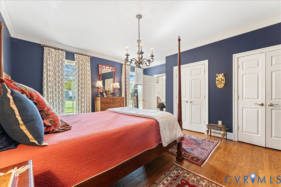 3581 Richards Run Powhatan, VA 23139 - Photo 25 of 50 a bedroom with a bed and a chandelier