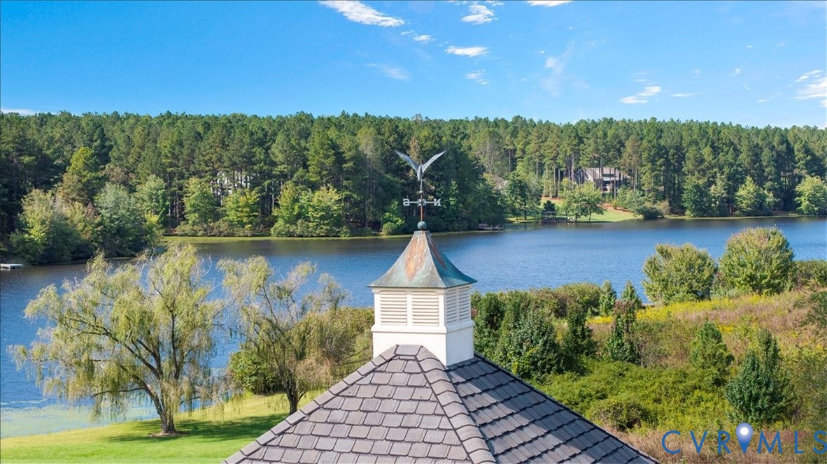 3581 Richards Run Powhatan, VA 23139 - Photo 43 of 50 a view of a lake with a mountain in the background