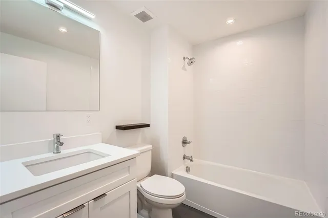 a bathroom with a sink a toilet and a bathtub