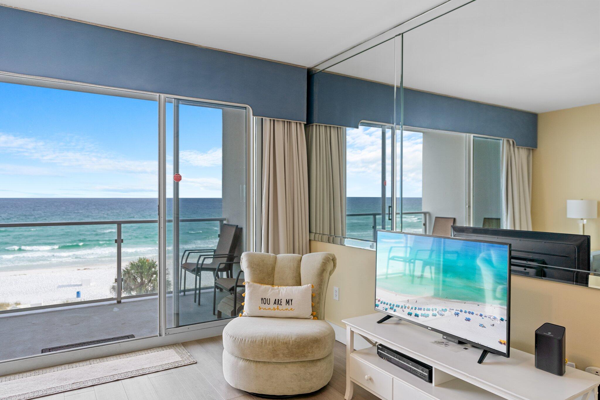 1080 Highway 98, Unit 403 Destin, FL 32541 - Photo 11 of 65 a living room with furniture and a floor to ceiling window