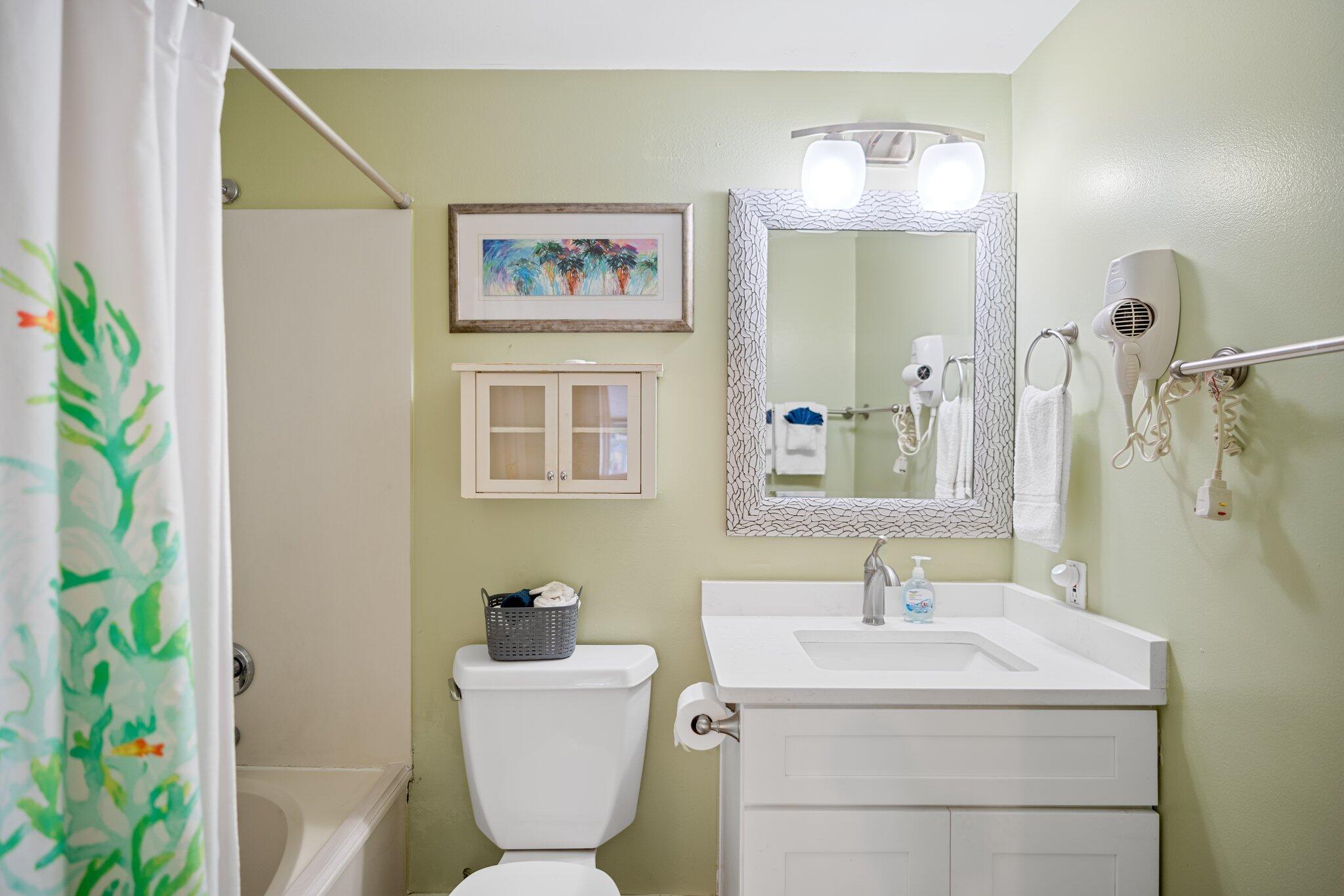 1080 Highway 98, Unit 403 Destin, FL 32541 - Photo 25 of 65 a bathroom with a sink and a mirror