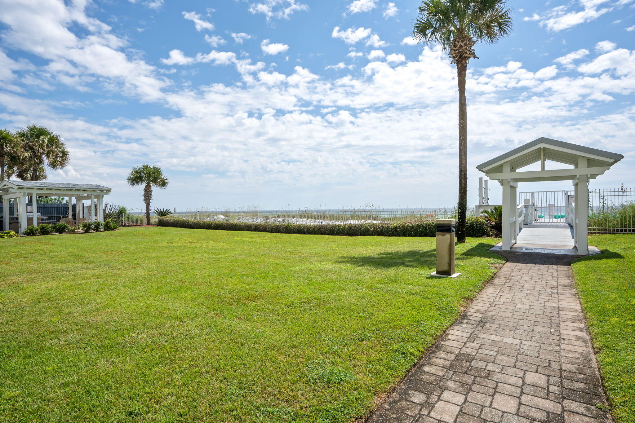 1080 Highway 98, Unit 403 Destin, FL 32541 - Photo 34 of 65 a front view of a house with garden