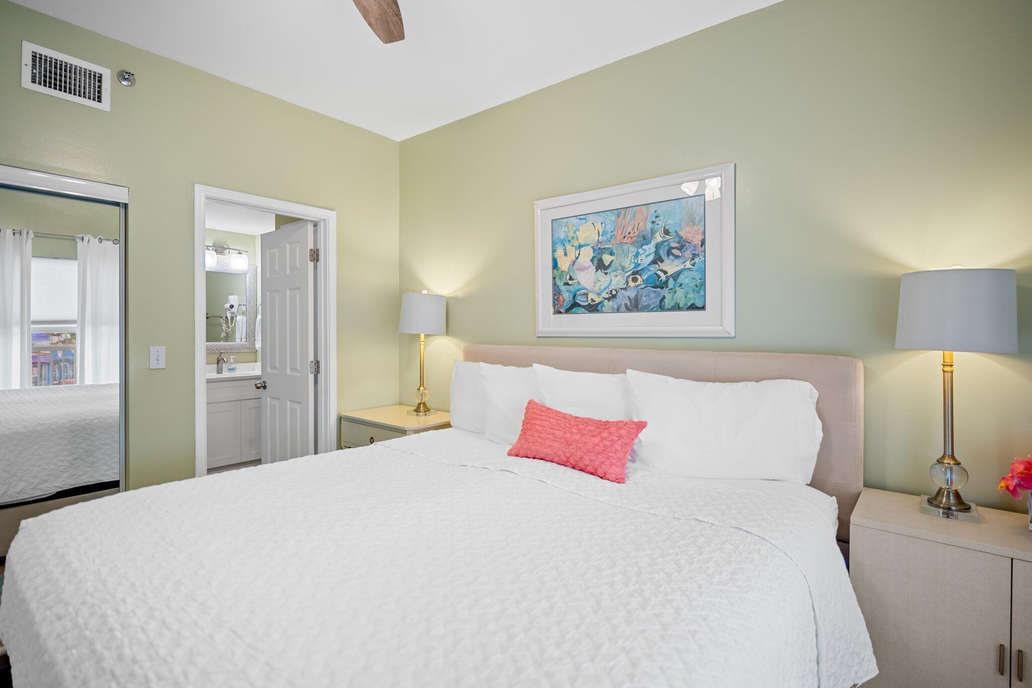 1080 Highway 98, Unit 403 Destin, FL 32541 - Photo 4 of 65 a bedroom with a bed and a painting on the wall