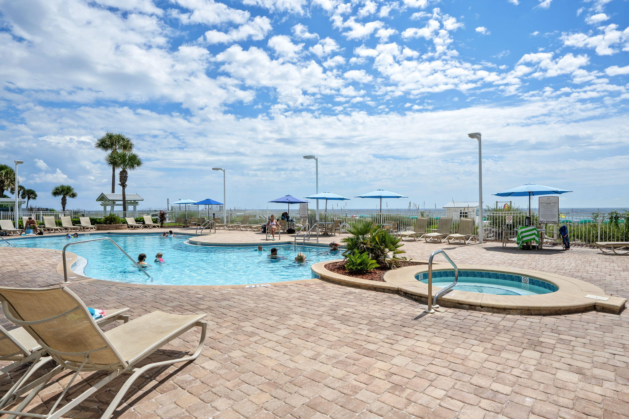 1080 Highway 98, Unit 403 Destin, FL 32541 - Photo 45 of 65 a view of a swimming pool and deck