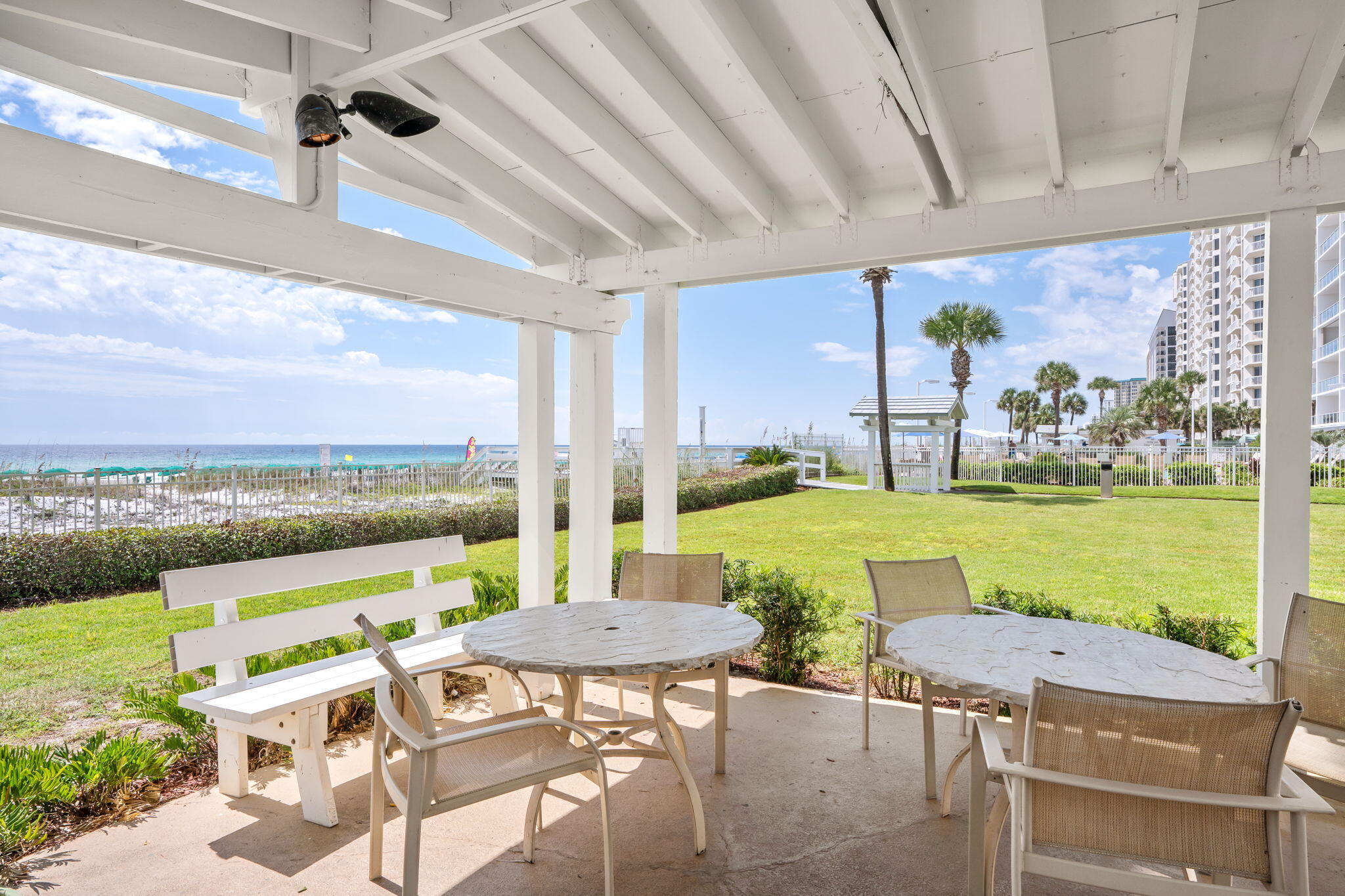 1080 Highway 98, Unit 403 Destin, FL 32541 - Photo 51 of 65 a view of a patio with a table chairs and a table