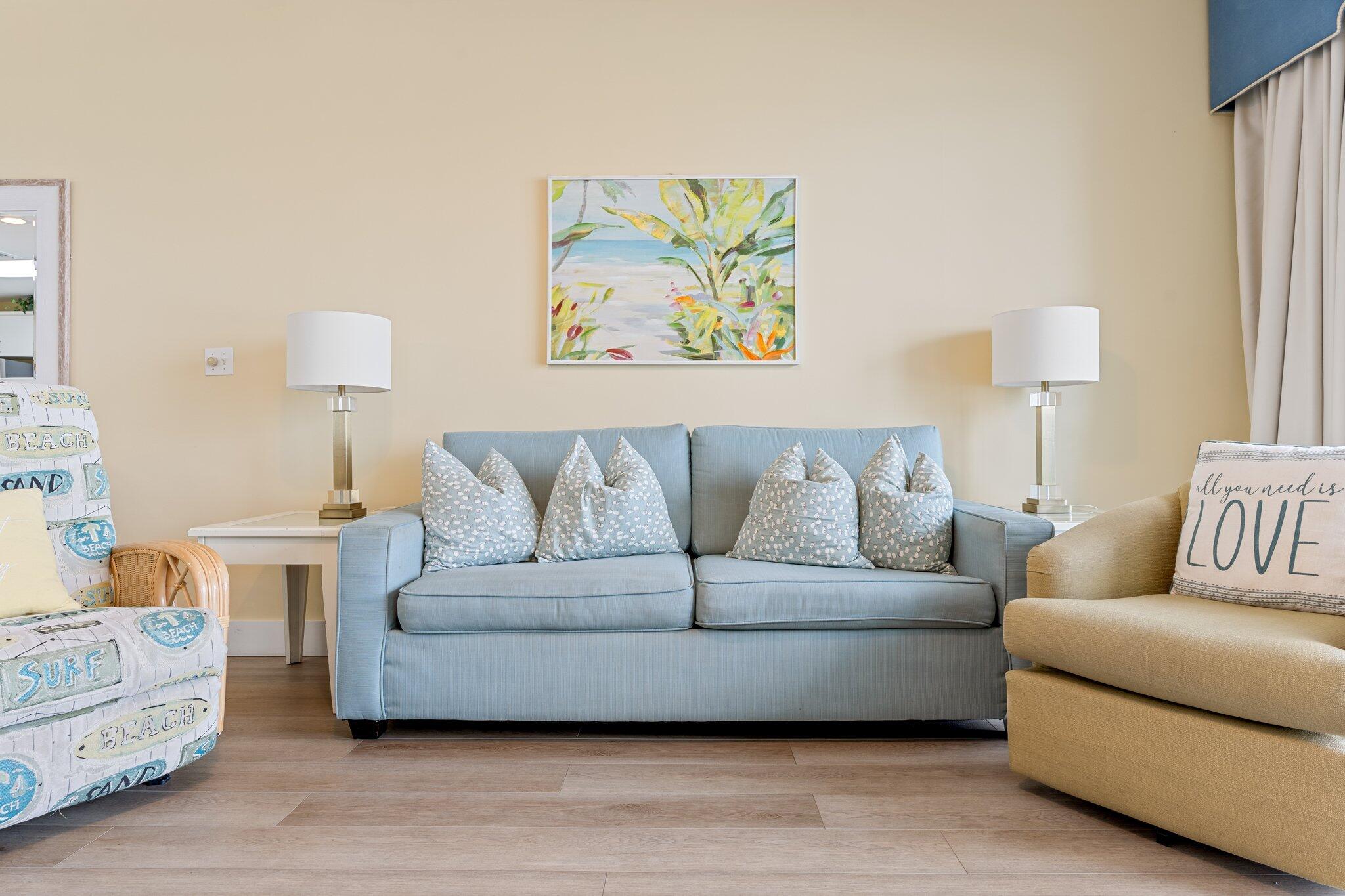 1080 Highway 98, Unit 403 Destin, FL 32541 - Photo 9 of 65 a living room with a couch and a lamp