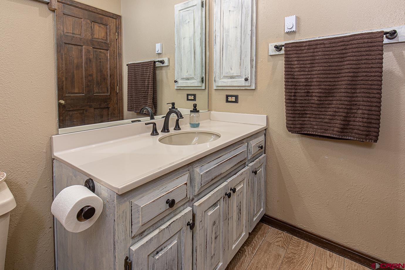 50827 Highway 550, Unit 330 Durango, CO 81301 - Photo 17 of 31 a bathroom with a sink and a mirror