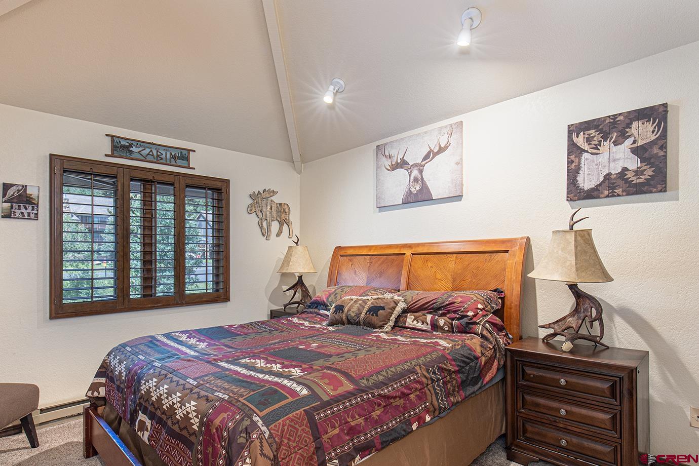 50827 Highway 550, Unit 330 Durango, CO 81301 - Photo 10 of 31 a bedroom with a large bed and a window