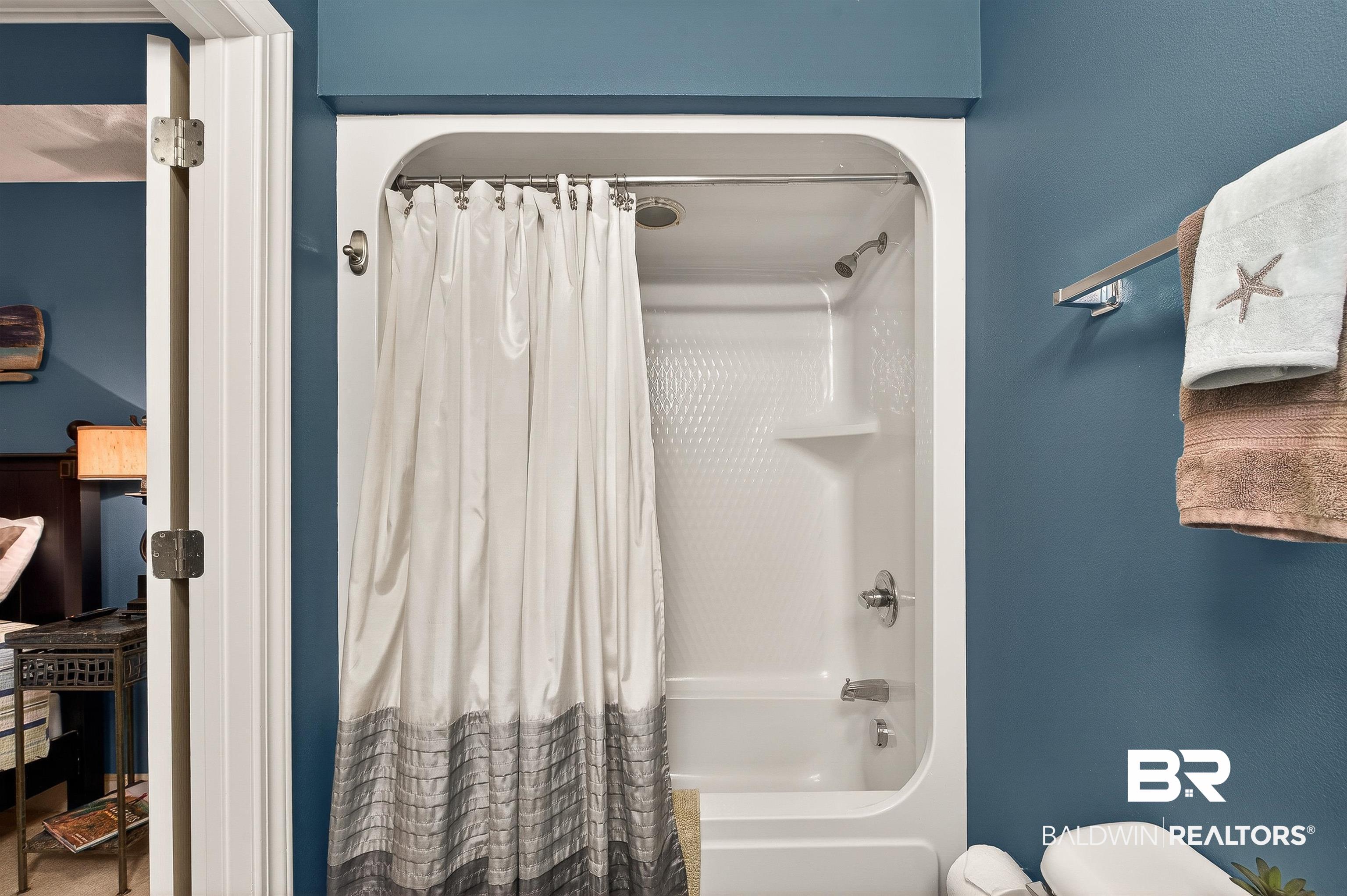 27582 Canal Road, Unit 2507 Orange Beach, AL 36561 - Photo 48 of 75 Full bathroom featuring shower / tub combo with curtain and toilet
