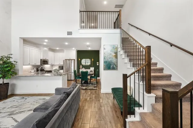 a view of a living room and kitchen with a large window