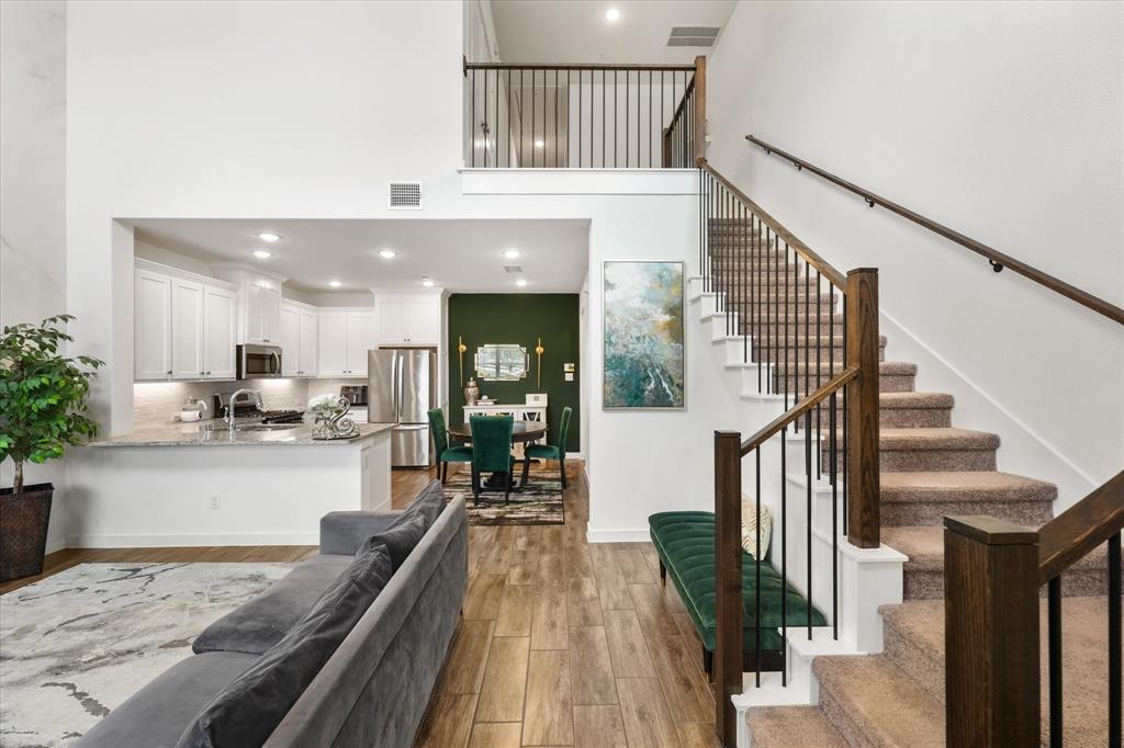 5824 Ridgeline Drive McKinney, TX 75070 - Photo 11 of 31 a view of a living room and kitchen with a large window