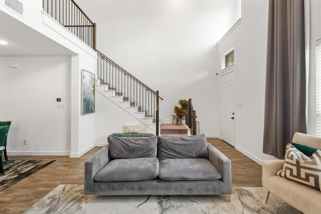 5824 Ridgeline Drive McKinney, TX 75070 - Photo 12 of 31 a living room with furniture or stairs and a wooden floor