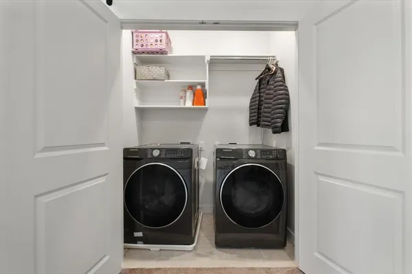 a utility room with dryer and washer
