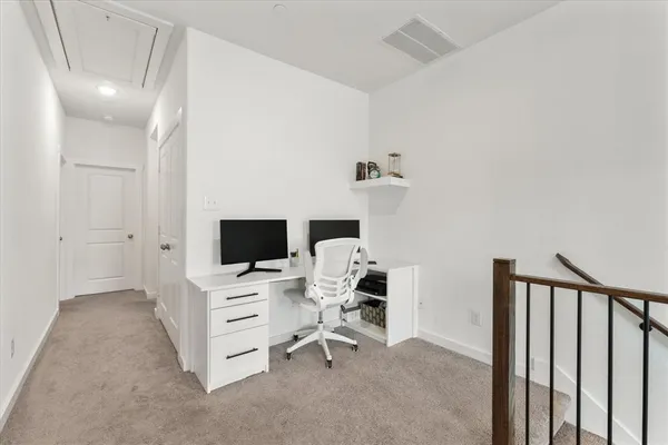 a view of a workspace with furniture