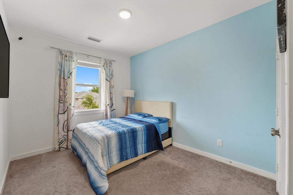 5824 Ridgeline Drive McKinney, TX 75070 - Photo 29 of 31 a bedroom with a bed and a window