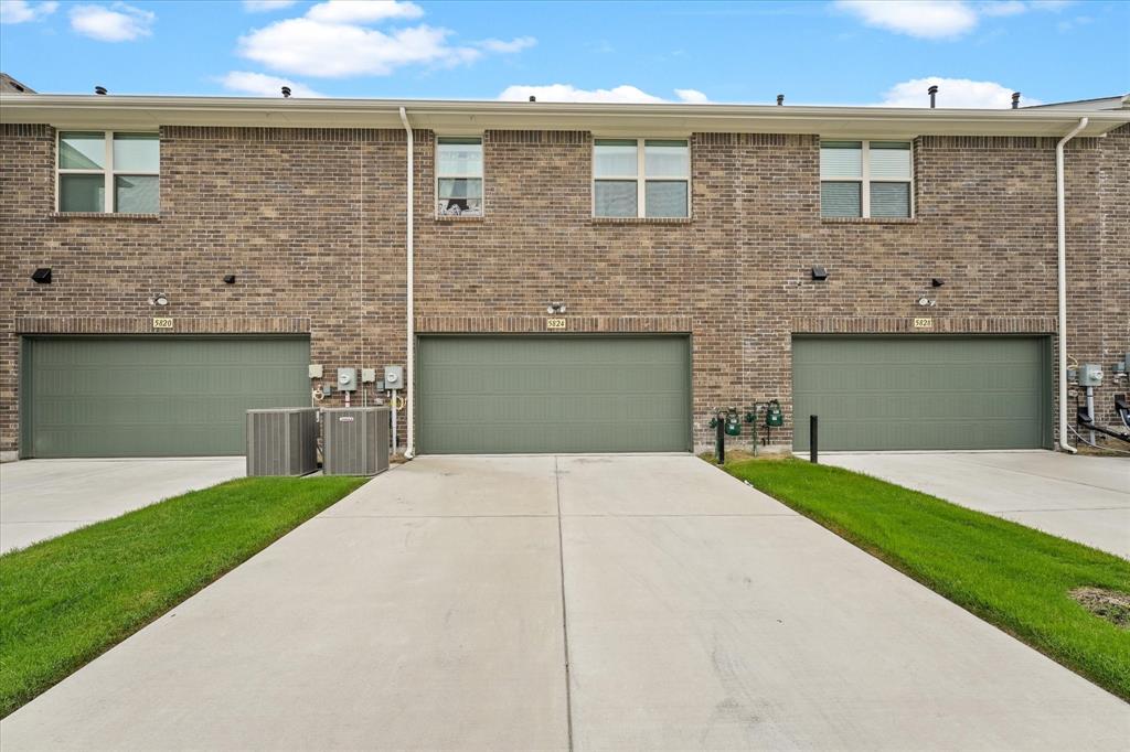 5824 Ridgeline Drive McKinney, TX 75070 - Photo 30 of 31 a front view of a house with a yard and garage