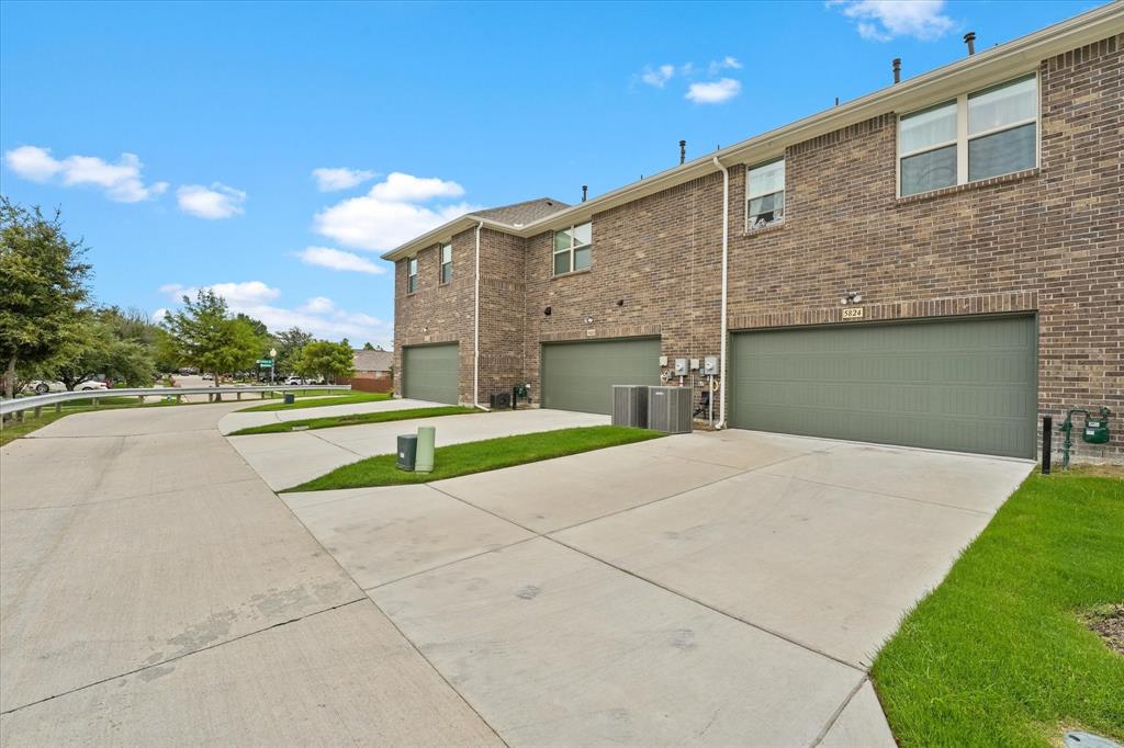 5824 Ridgeline Drive McKinney, TX 75070 - Photo 31 of 31 a view of a house with a yard and garage