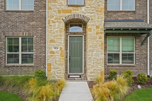 a front view of a house having yard