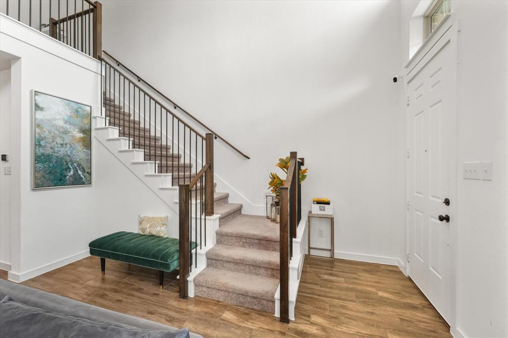 5824 Ridgeline Drive McKinney, TX 75070 - Photo 5 of 31 a view of entryway and hall with wooden floor