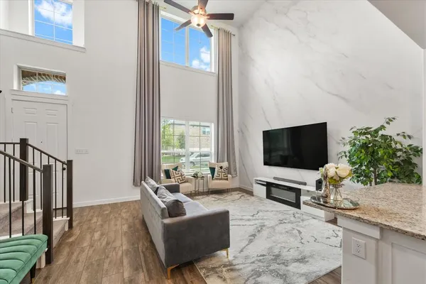 a living room with furniture and a flat screen tv