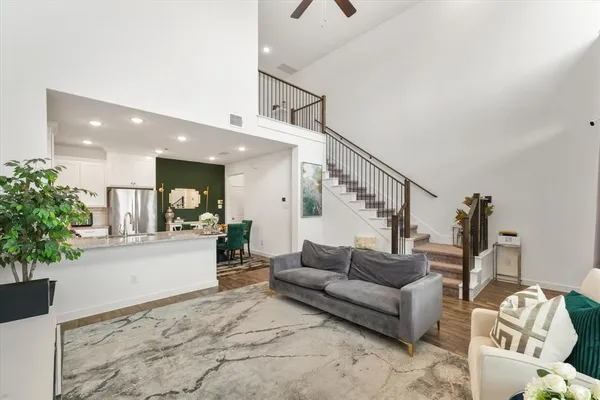 a living room with furniture and flowers