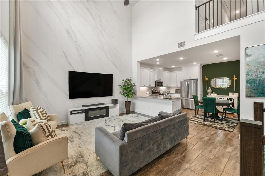 5824 Ridgeline Drive McKinney, TX 75070 - Photo 10 of 31 a living room with furniture and a flat screen tv