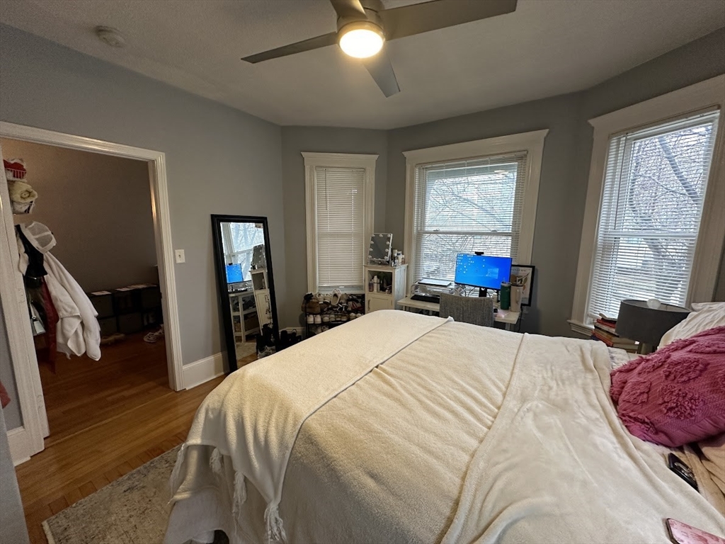 207 Boston Avenue, Unit B Medford, MA 02155 - Photo 17 of 17 a bedroom with a bed and large windows