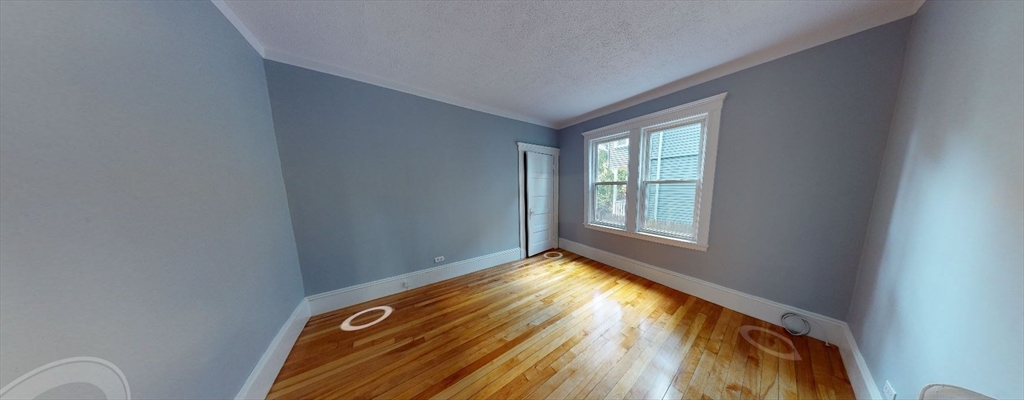 207 Boston Avenue, Unit B Medford, MA 02155 - Photo 7 of 17 a view of an empty room and window