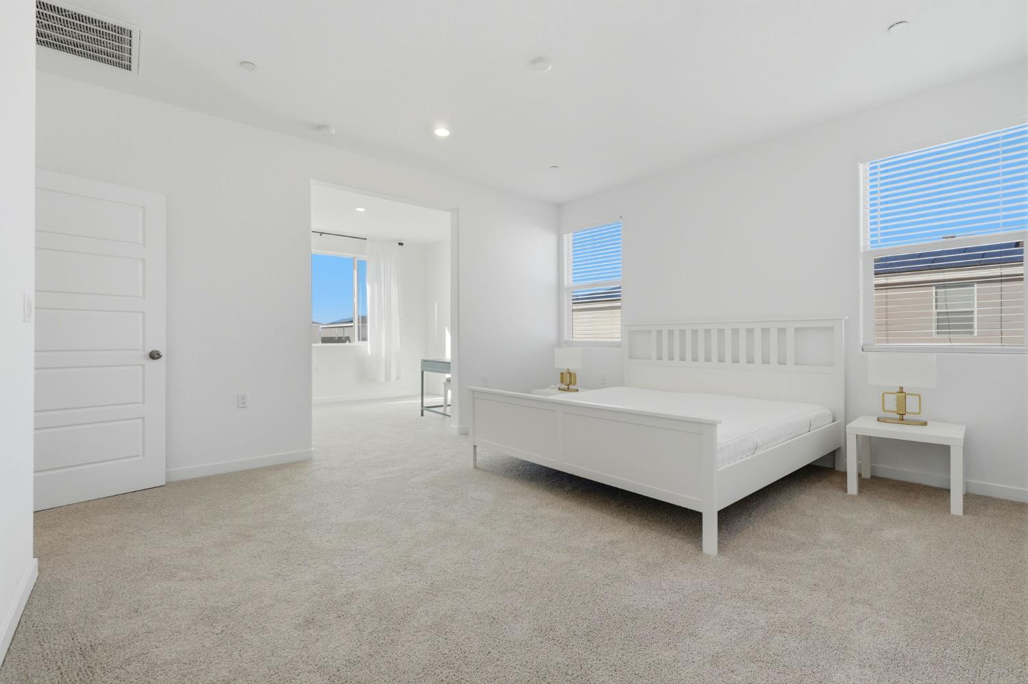 4225 Hampton Way Clovis, CA 93619 - Photo 22 of 37 a spacious bedroom with a bed and a chair