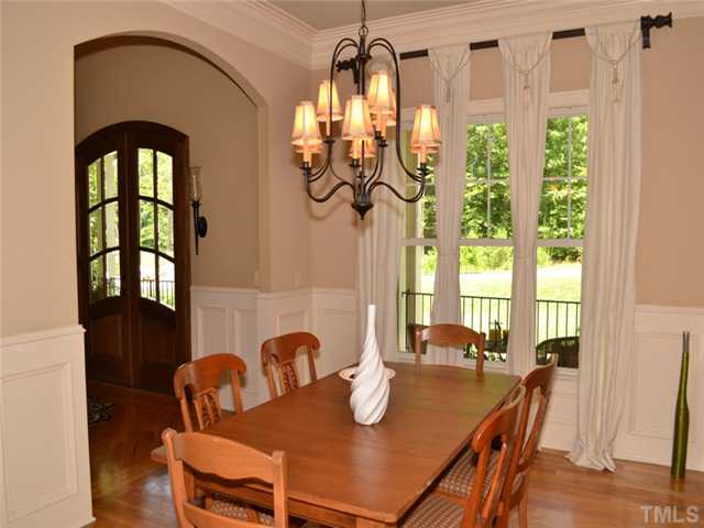 9009 Albatross Court Raleigh, NC 27613 - Photo 8 of 25 a view of a dining room with furniture window and outside view
