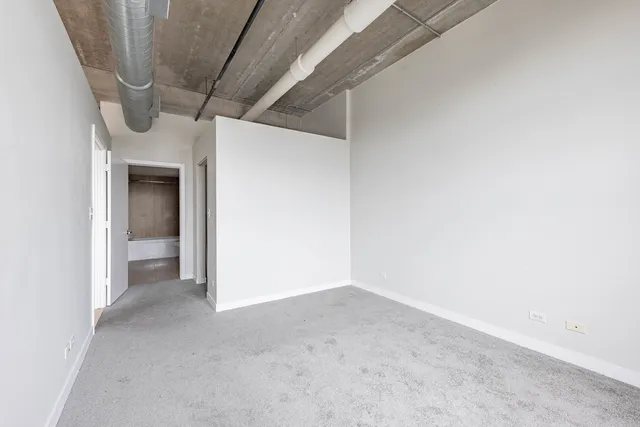 a view of a room with a hallway