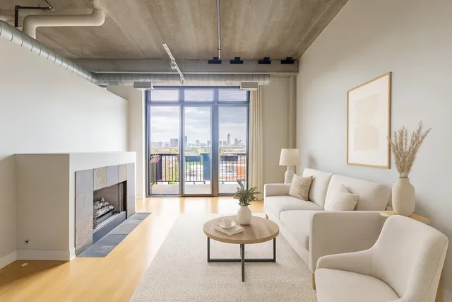 a living room with furniture fireplace and flat screen tv