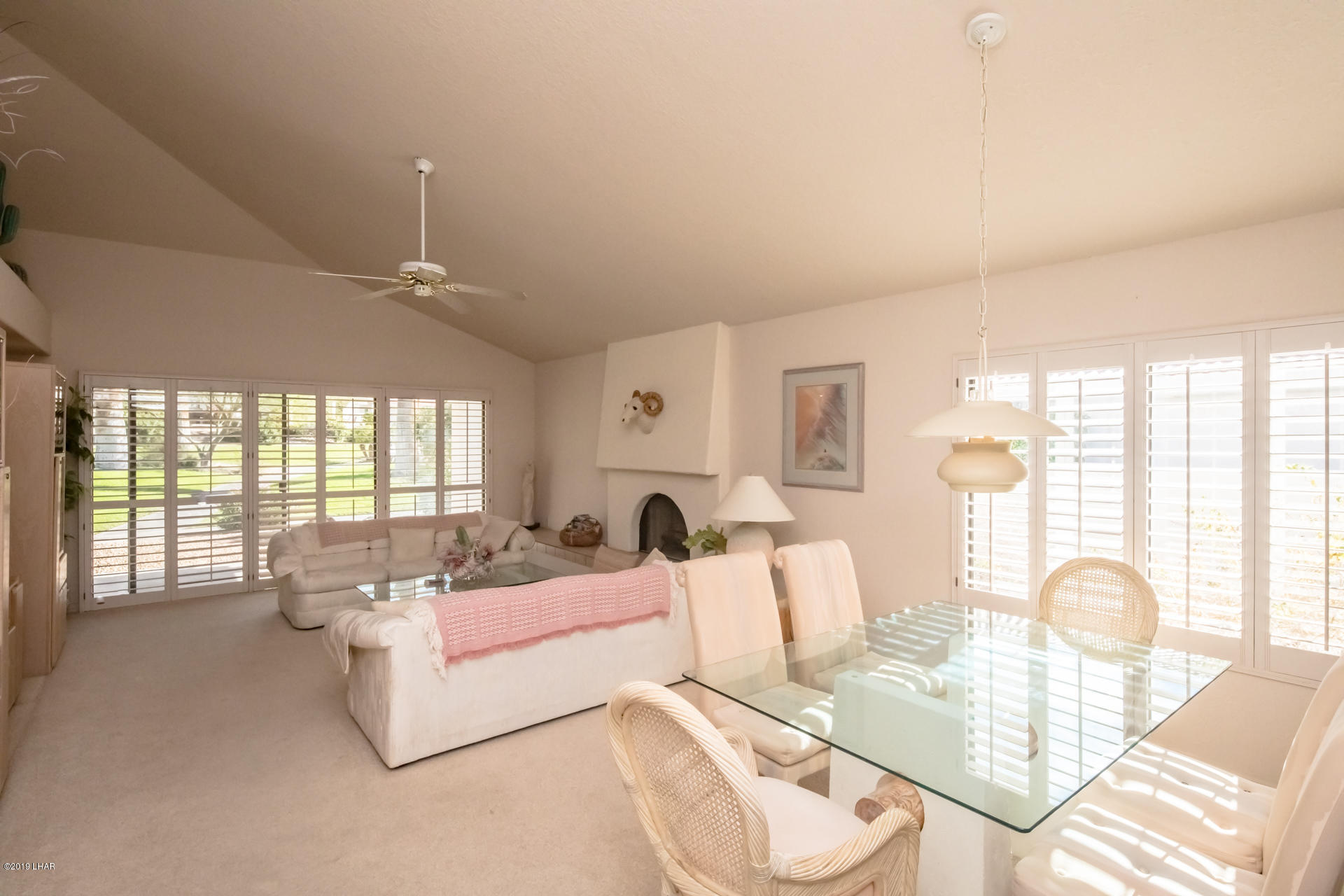 375 London Bridge Road, Unit 65 Lake Havasu City, AZ 86403 - Photo 9 of 35 Open Front Room with Vaulted Ceilings for the dramatic affect. Also a wood burning fireplace.
