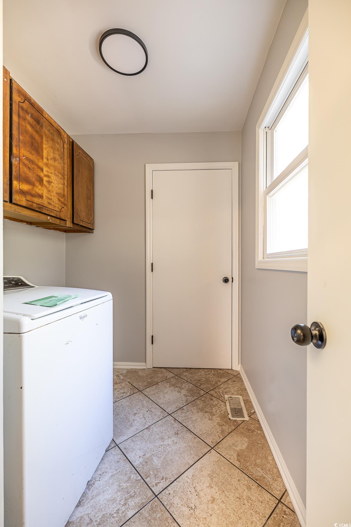 117 George Washington Trail Georgetown, SC 29440 - Photo 17 of 30 Laundry room with washer / clothes dryer, light tile patterned floors, and cabinets