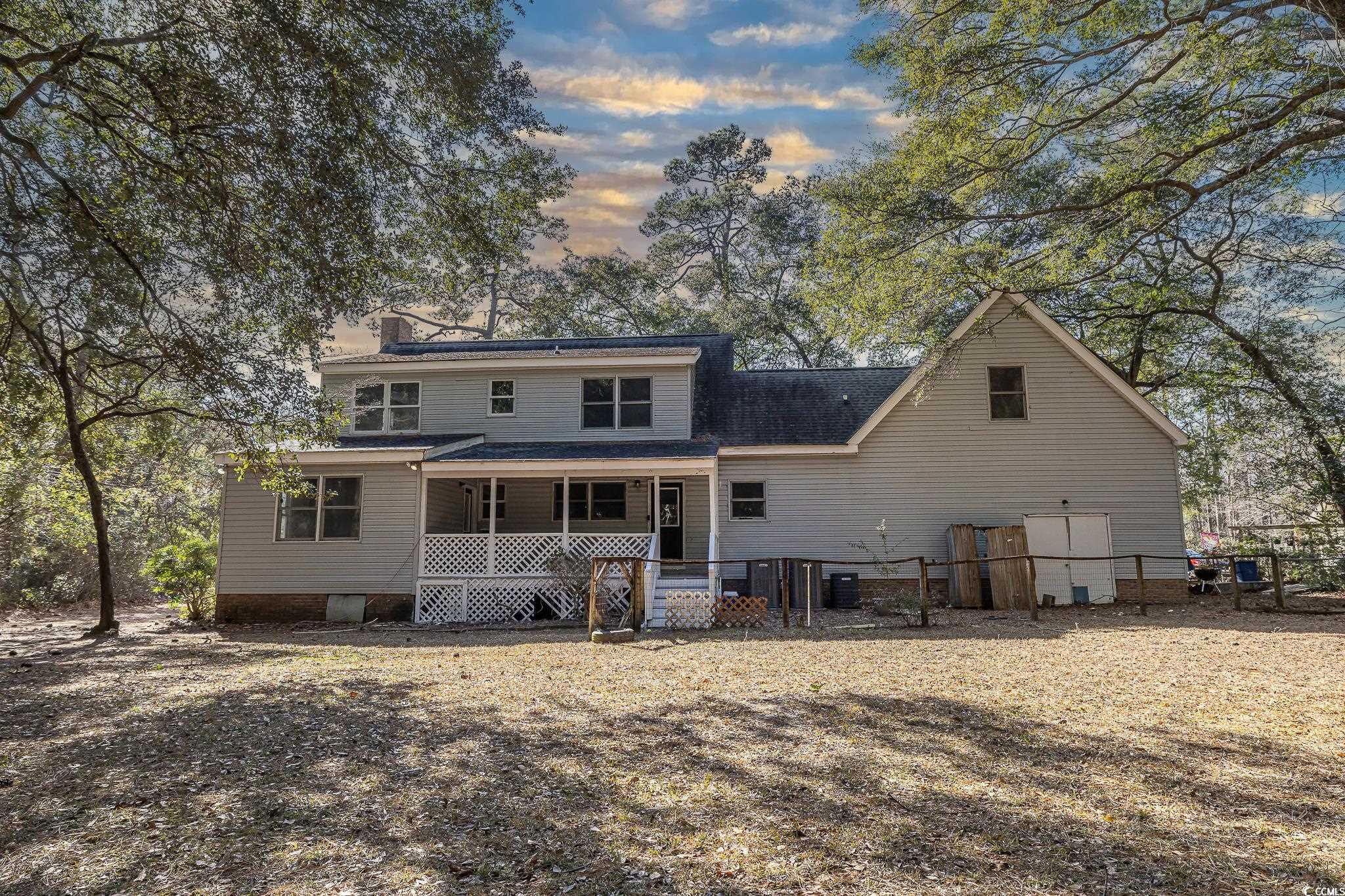 117 George Washington Trail Georgetown, SC 29440 - Photo 6 of 30 Back house at dusk with central air condition unit