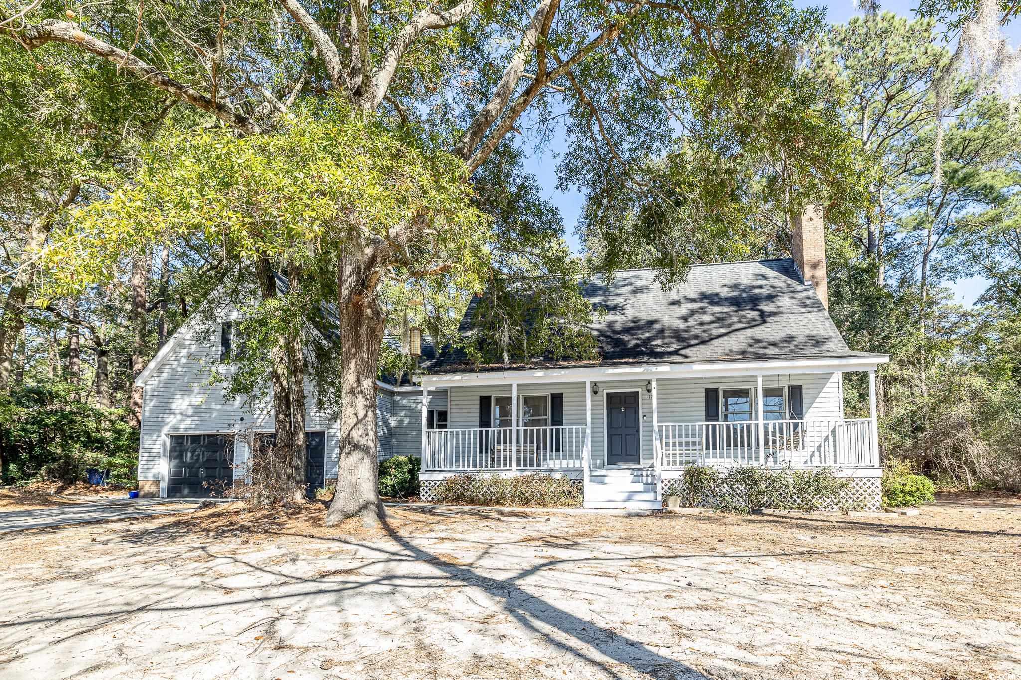 117 George Washington Trail Georgetown, SC 29440 - Photo 7 of 30 View of front of home featuring a porch and a garage