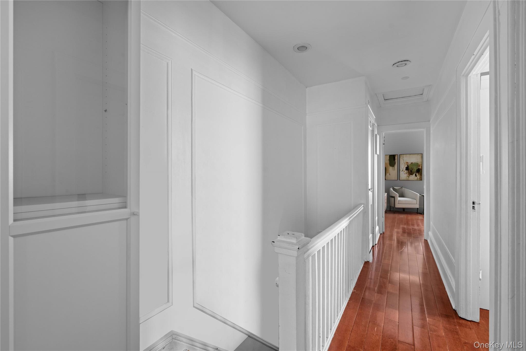 89-13 85th Street Queens, NY 11421 - Photo 6 of 15 Corridor featuring hardwood / wood-style flooring and attic access