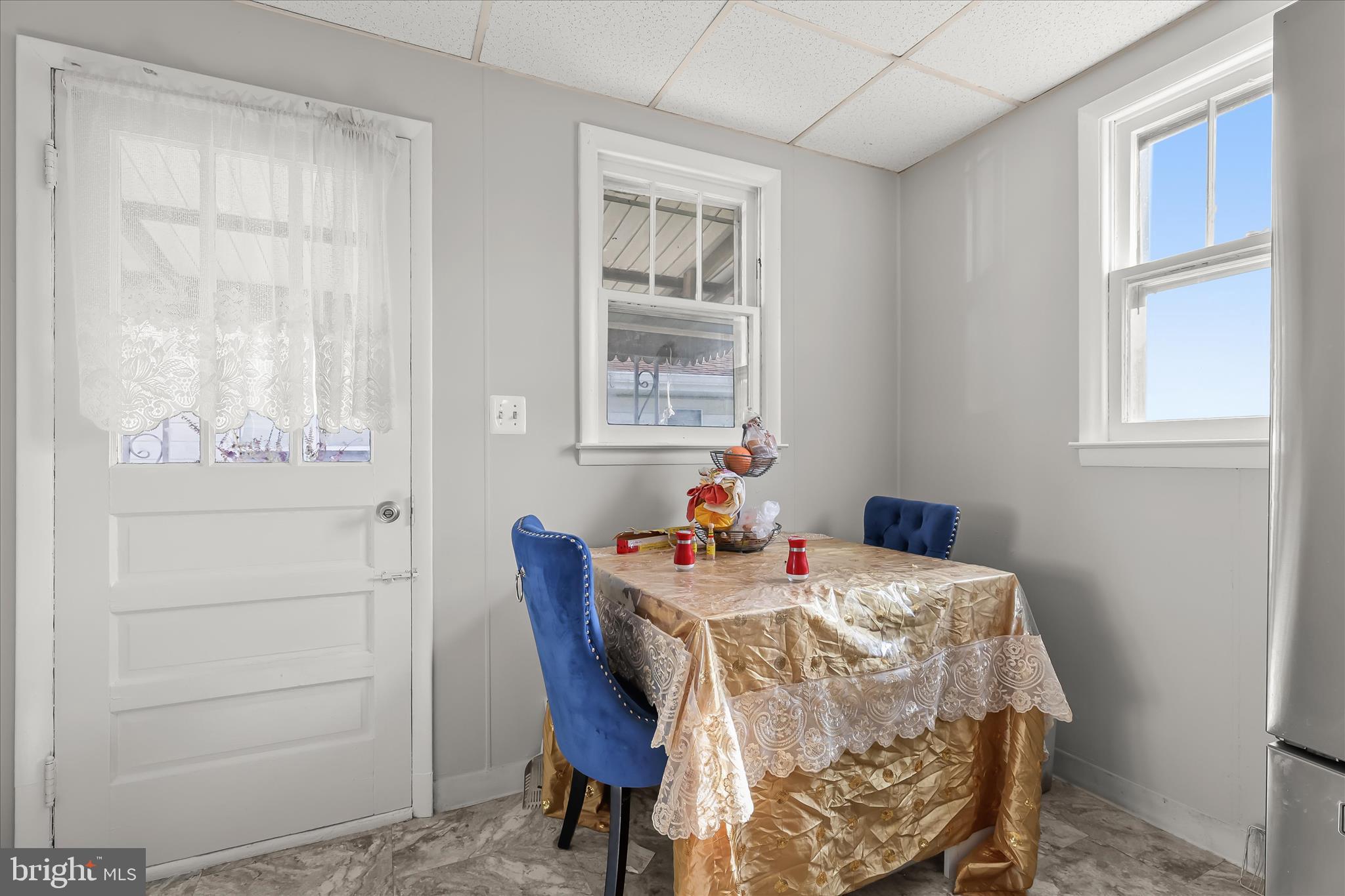 2813 Oak Grove Avenue Halethorpe, MD 21227 - Photo 12 of 43 a view of a dining room with furniture and a window