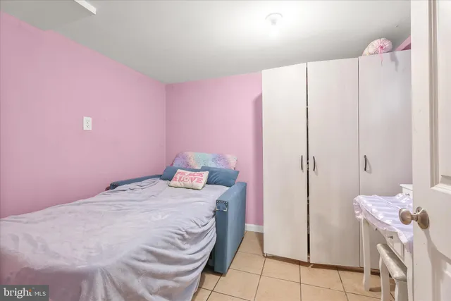a bedroom with a bed and a cabinets