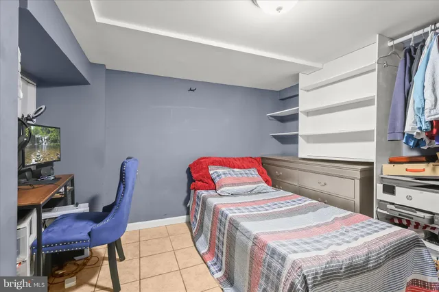 a bedroom with a bed and a closet