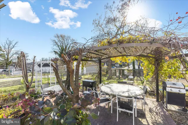 a view of a patio with a table and chairs