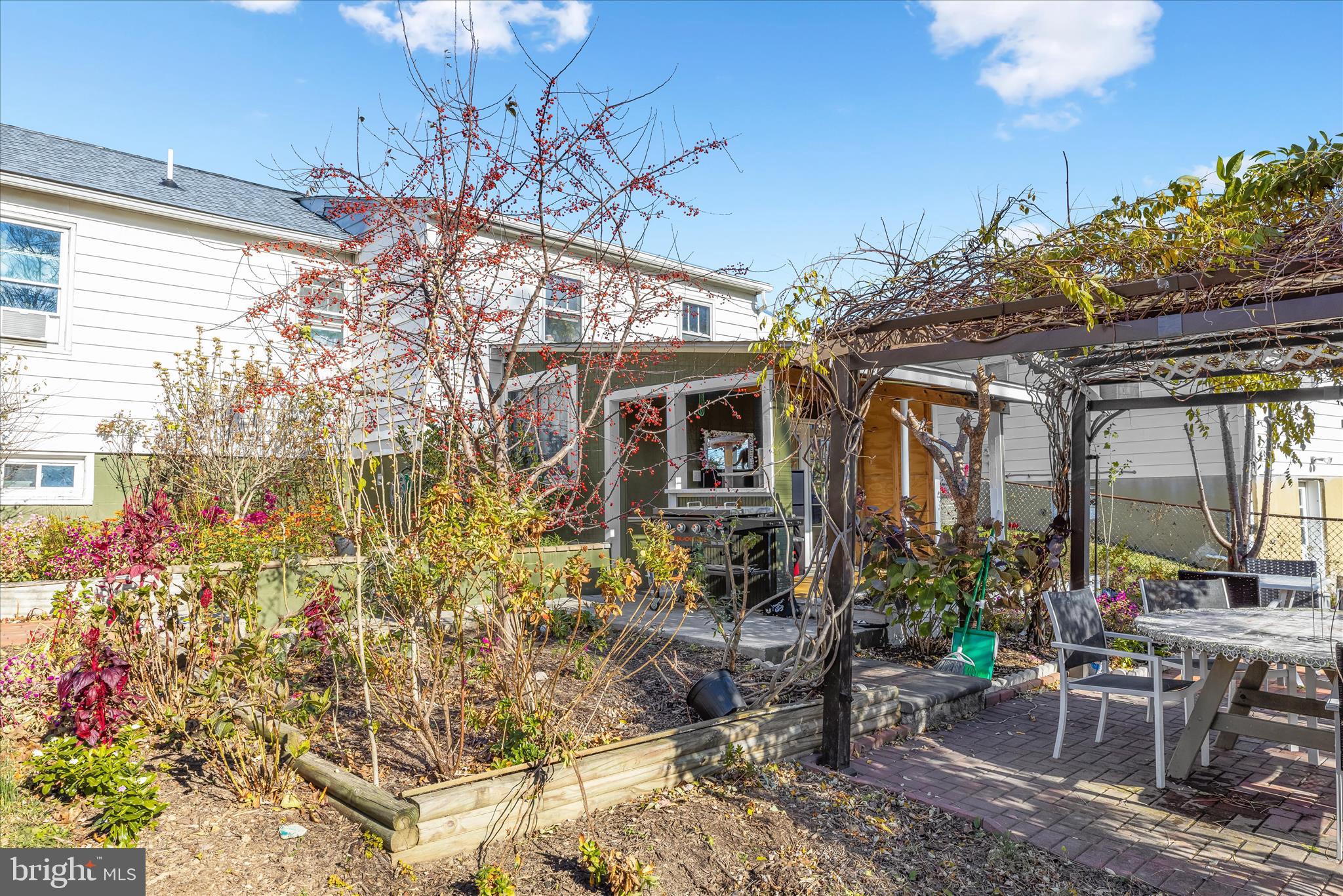 2813 Oak Grove Avenue Halethorpe, MD 21227 - Photo 29 of 43 a view of a patio with table and chairs and potted plants